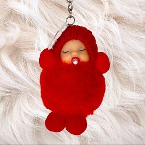 SLEEPY BABY‎ WITH PACIFIER SMALL POMPON IN RED KEYCHAIN CHARM